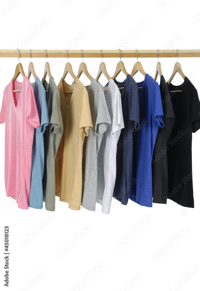 Choice of man clothes of different colors on wooden hangers Choice of man clothes of different colors on wooden hangers