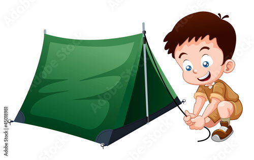 Boy scout with camping tent