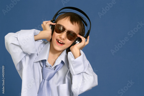 Caucasian nice young man with headphones posing