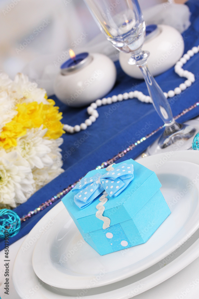 Blue gift for guests on wedding table close-up Blue gift for guests on wedding table close-up