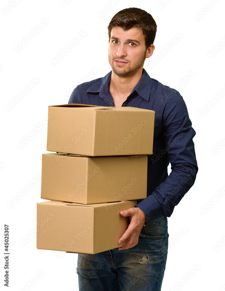 A Young Man Holding A Stack Of Cardboard Boxes A Young Man Holding A Stack Of Cardboard Boxes