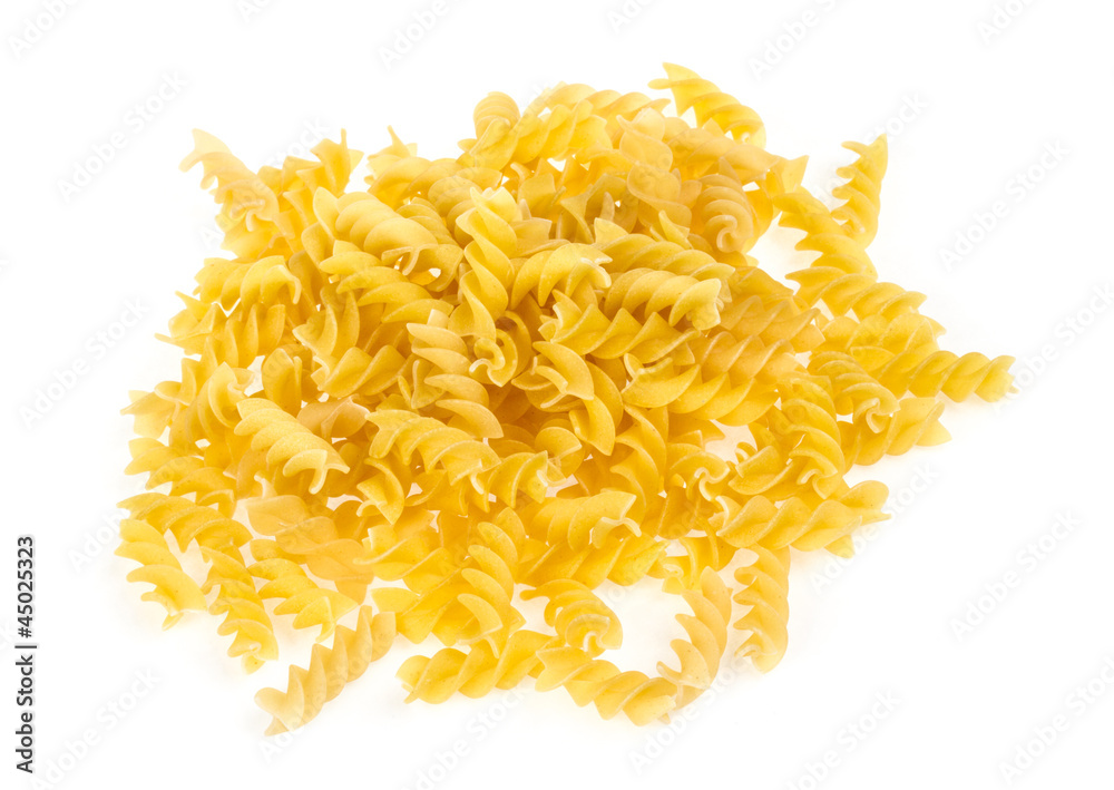 A portion of Rotini corkscrew pasta isolated on white. A portion of Rotini corkscrew pasta isolated on white.