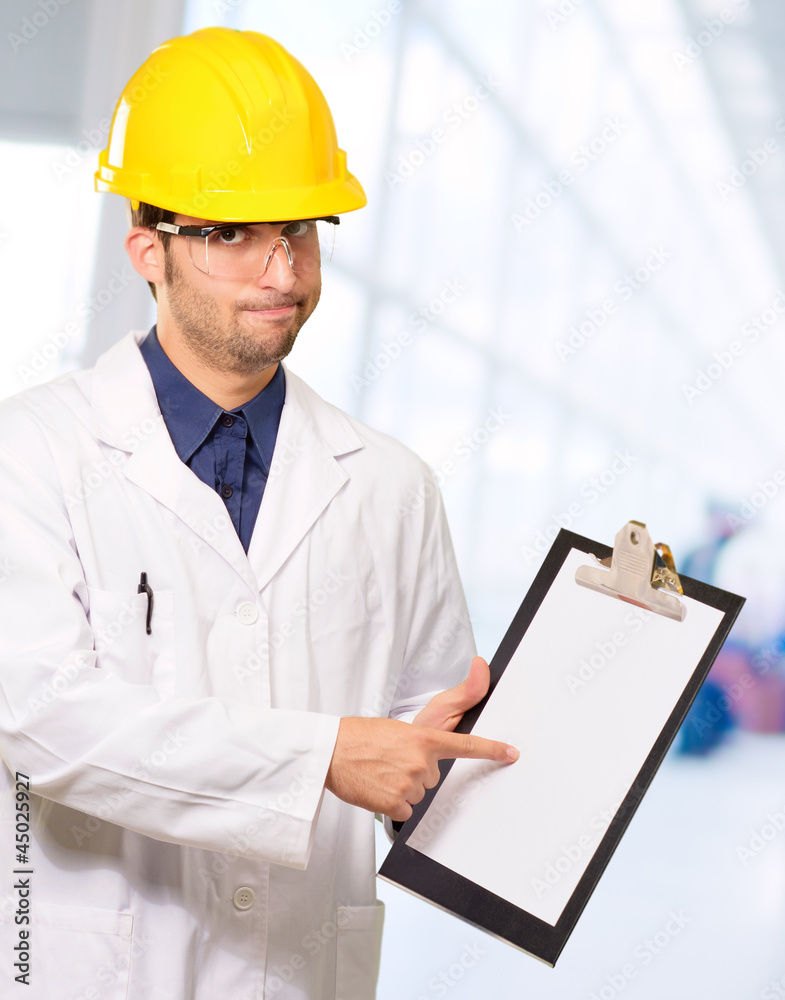 Technician Holding Writing Pad