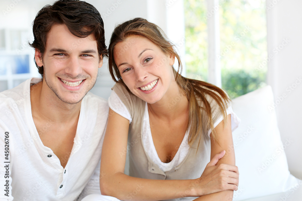 Portrait of smiling young couple at home Portrait of smiling young couple at home