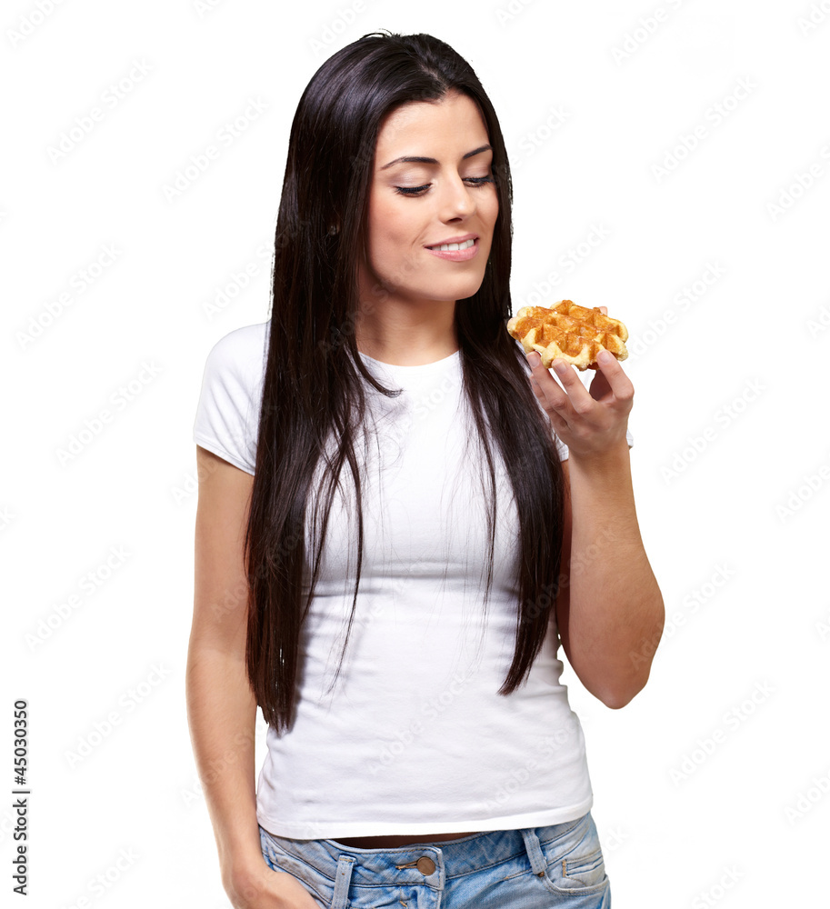 A Young Woman Holding And Looking At Waffle