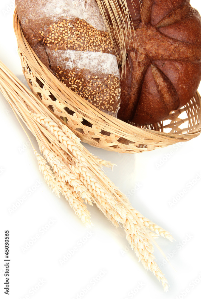 Homemade whole bread on white background close-up