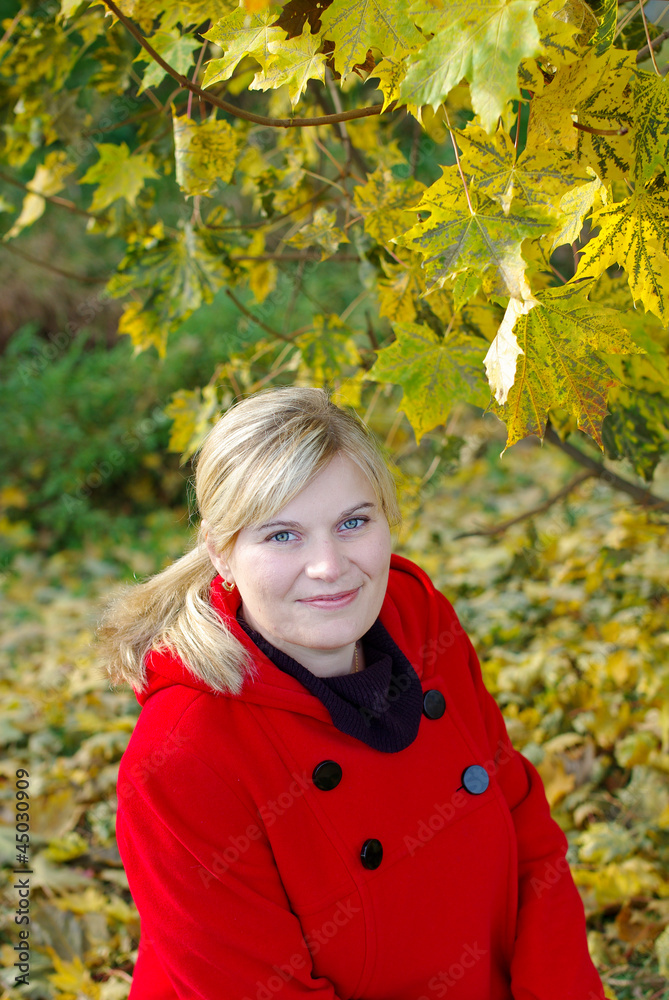 Beautiful woman in red coat in autumn forest Beautiful woman in red coat in autumn forest