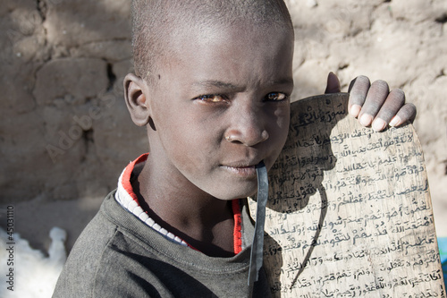 Boy showing his Arabic manuscript, Timbuktu, Mali. photo