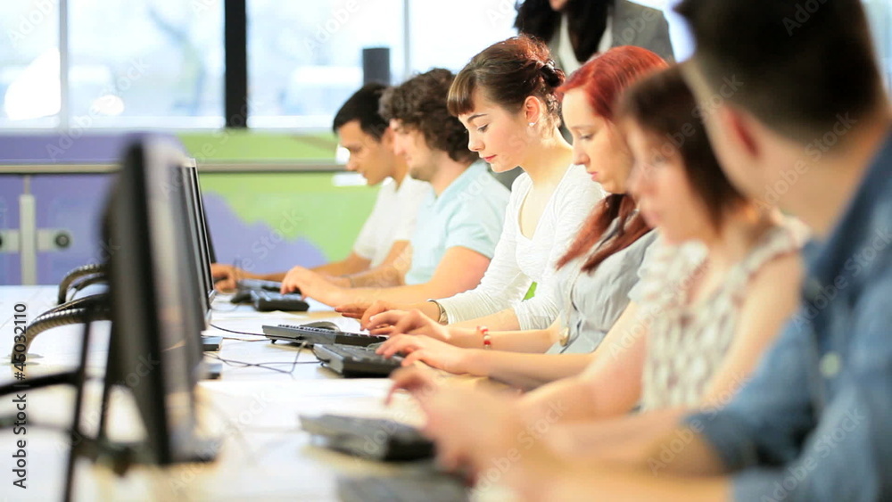 University teacher learning students online on computers University teacher learning students online on computers