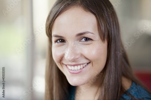 Portrait of a cute young woman smiling