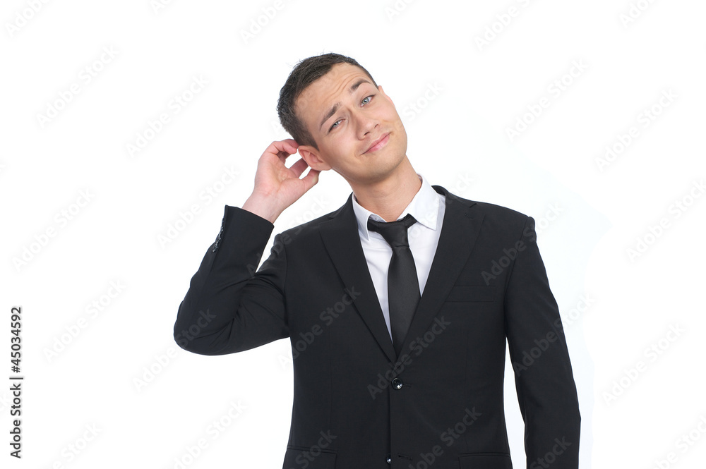 Businessman scratching his head Businessman scratching his head