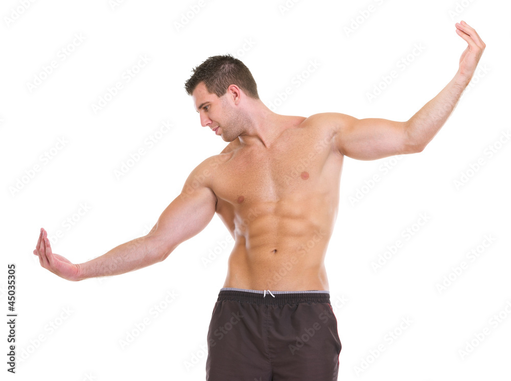 Male athlete with muscular body gracefully posing Male athlete with muscular body gracefully posing