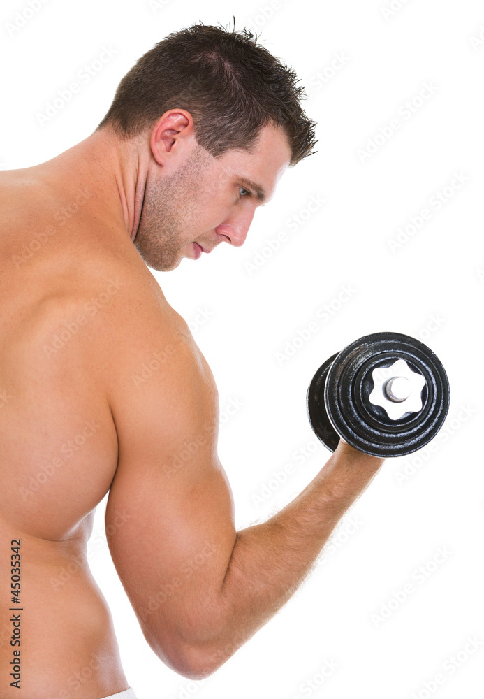Male athlete with strong biceps rising dumbbell Male athlete with strong biceps rising dumbbell