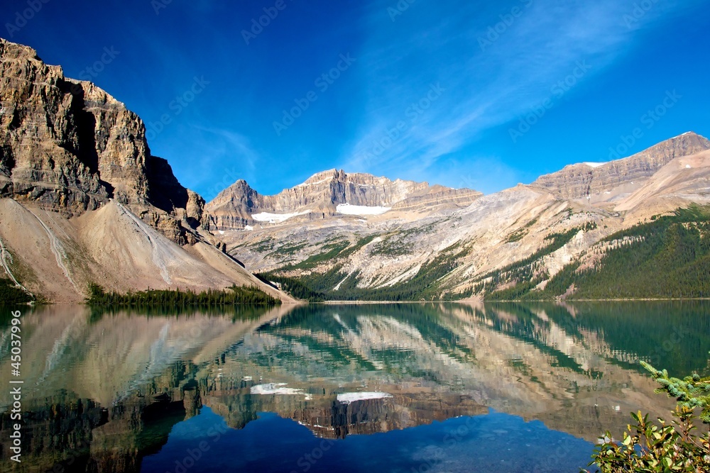 Quiet scenery of Bow Lake with the Rocky Mountains reflecting