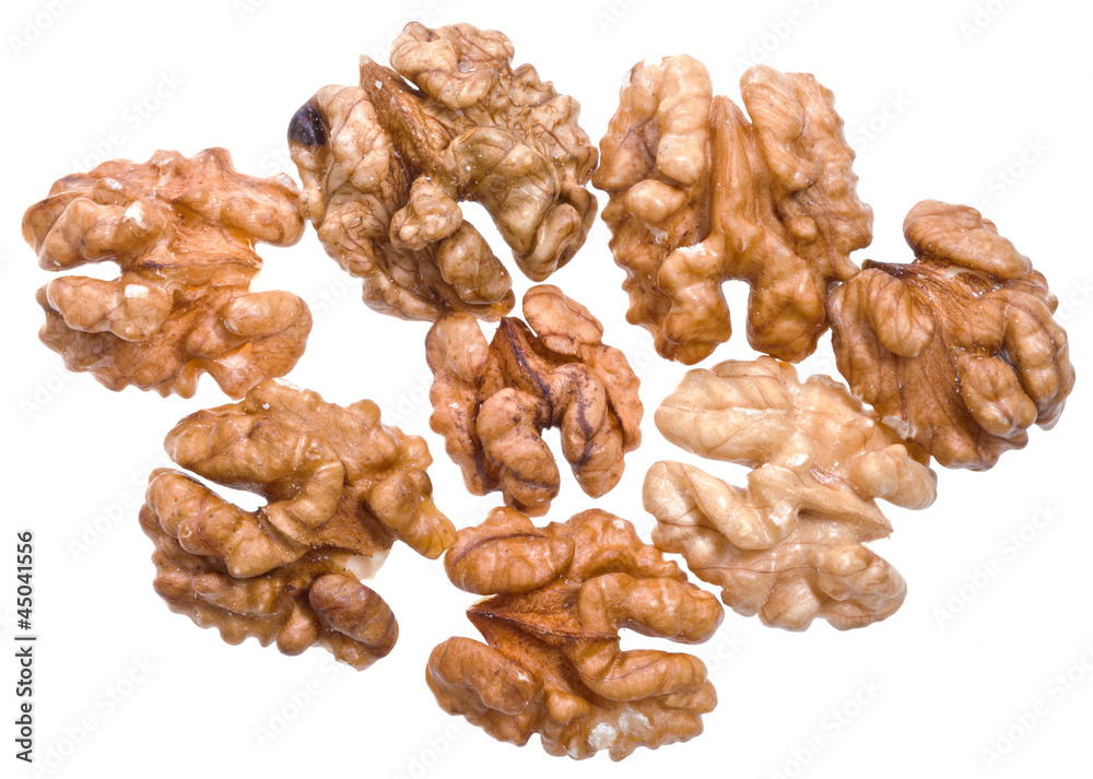 several peeled walnut kernels isolated on white several peeled walnut kernels isolated on white