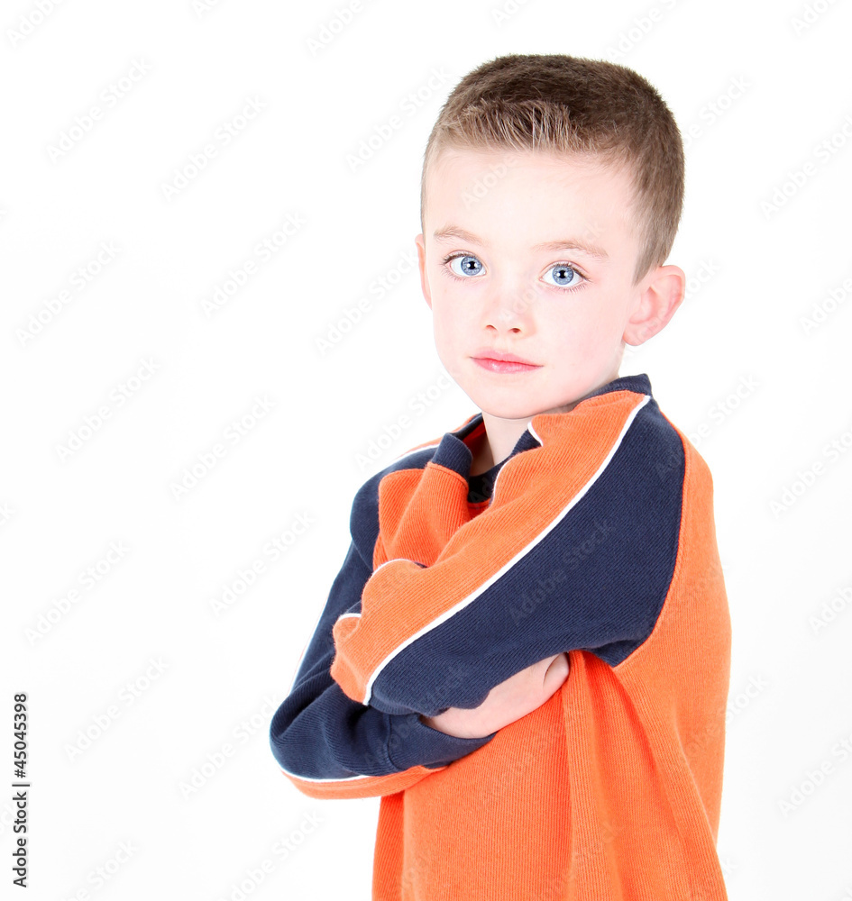 Young boy with arms crossed isolated on white Young boy with arms crossed isolated on white