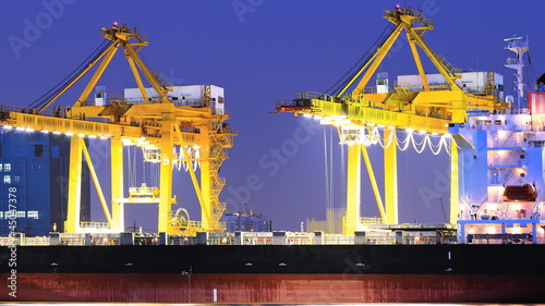 crane bridge at dusk for Logistic Import Export