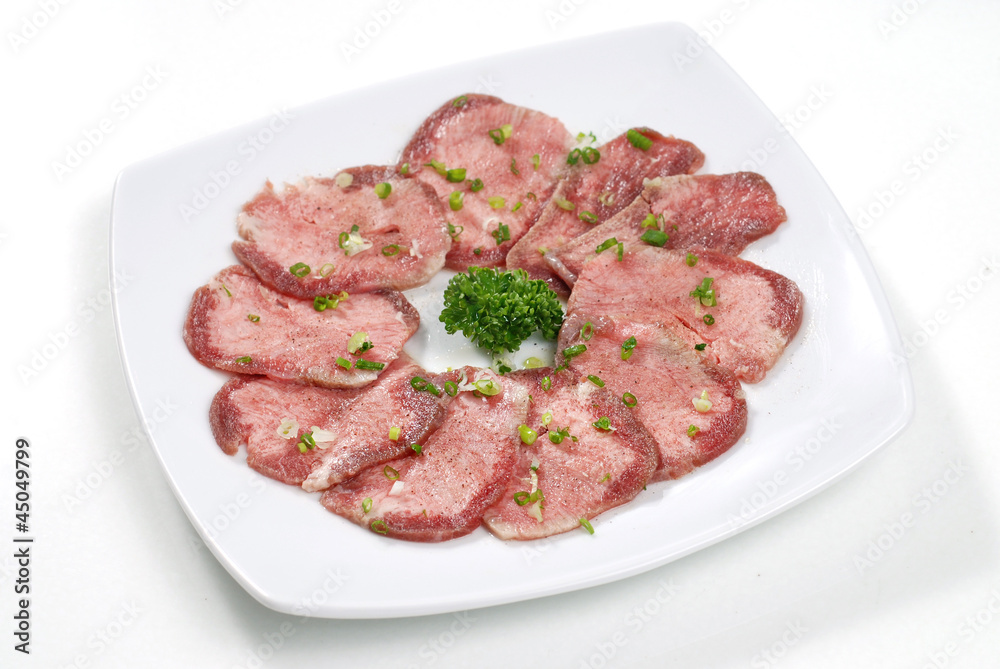 beef tongue sliced on white dish