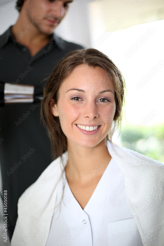 Woman having her hair dried by hairdresser Woman having her hair dried by hairdresser