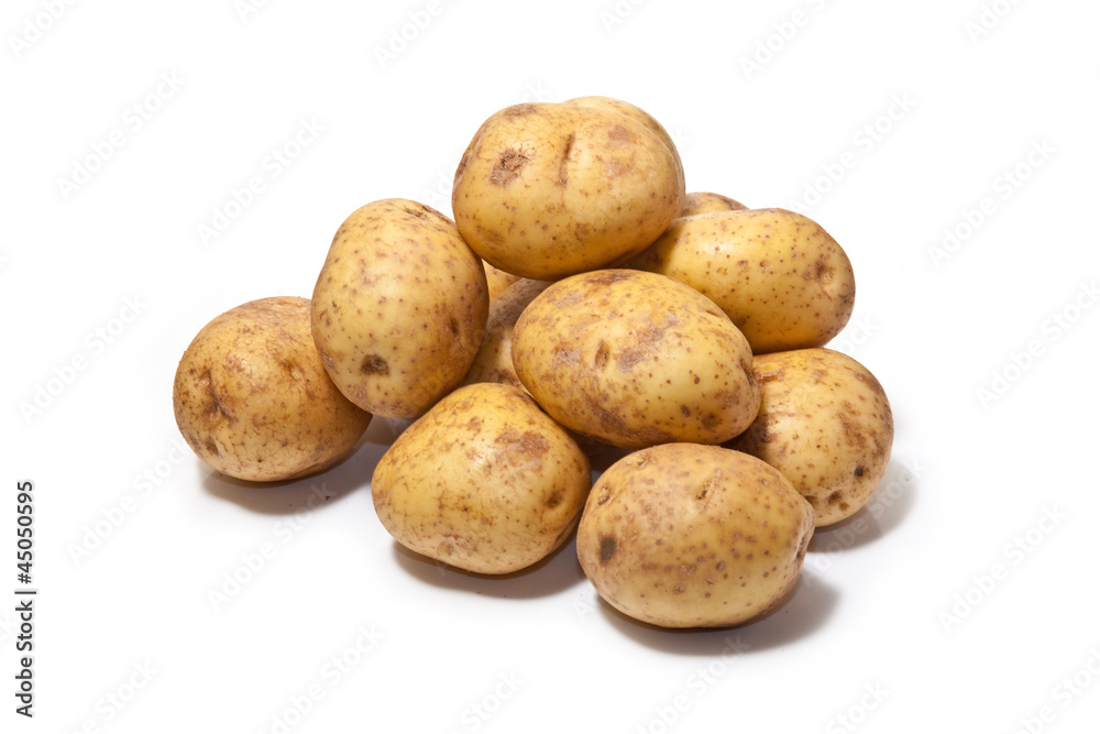 White Potatoes isolated on a white studio background. White Potatoes isolated on a white studio background.