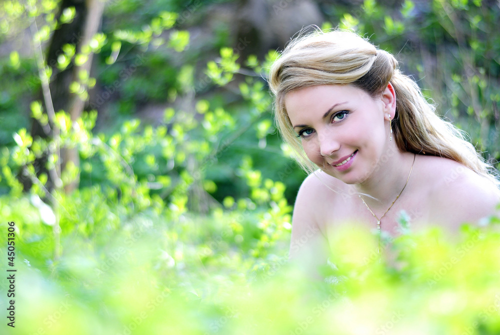 beautiful girl in wood amongst green sheet beautiful girl in wood amongst green sheet