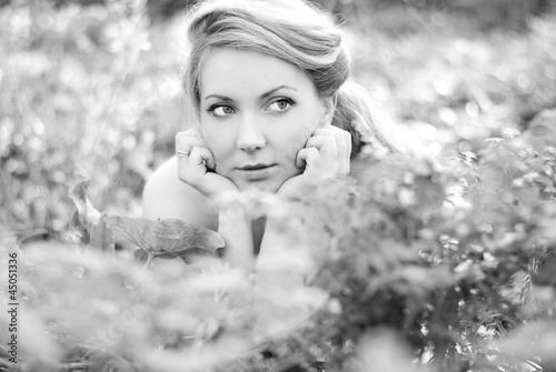 beautiful girl in wood amongst green sheet