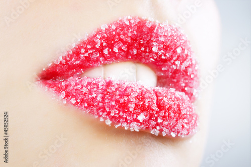 Woman's lips strewed with sugar
