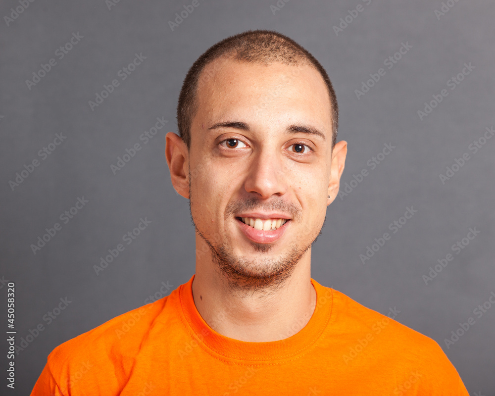 Obraz premium Young Man Portrait on Grey Background