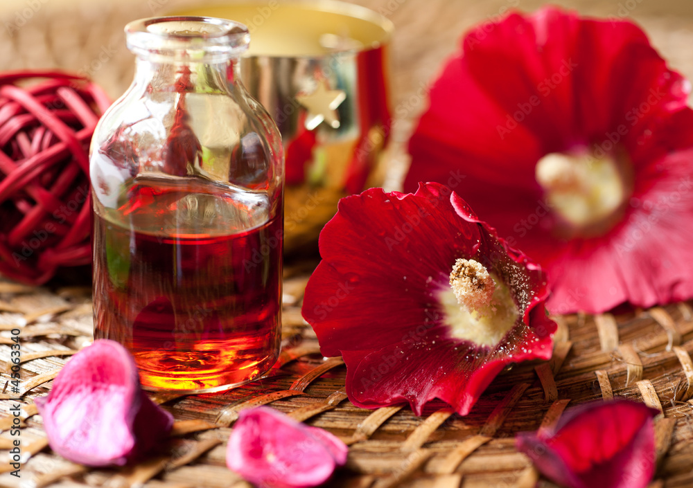 Essential Oil for aromatherapy and red flowers Essential Oil for aromatherapy and red flowers