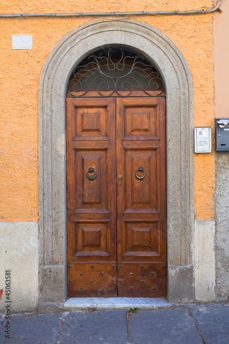 Wooden door. Bagnaia. Lazio. Italy.
