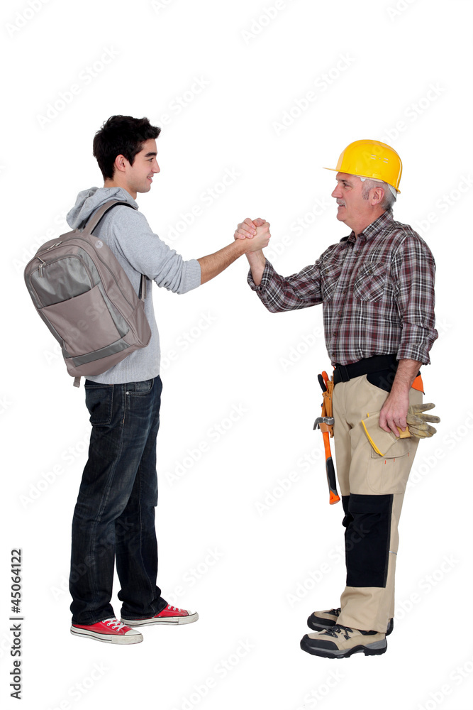 Tradesman making a pact with a young man Tradesman making a pact with a young man