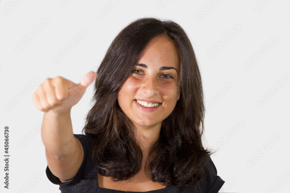 Portrait of attractive young female showing a thumbs up Portrait of attractive young female showing a thumbs up