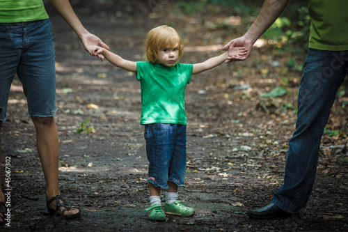 Sad looking girl with her parents