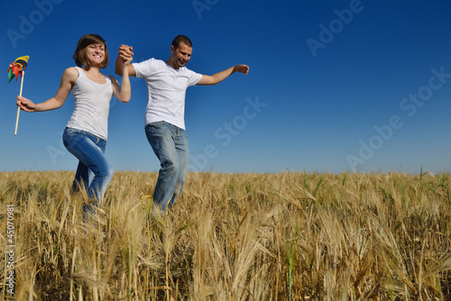 happy couple in wheat field