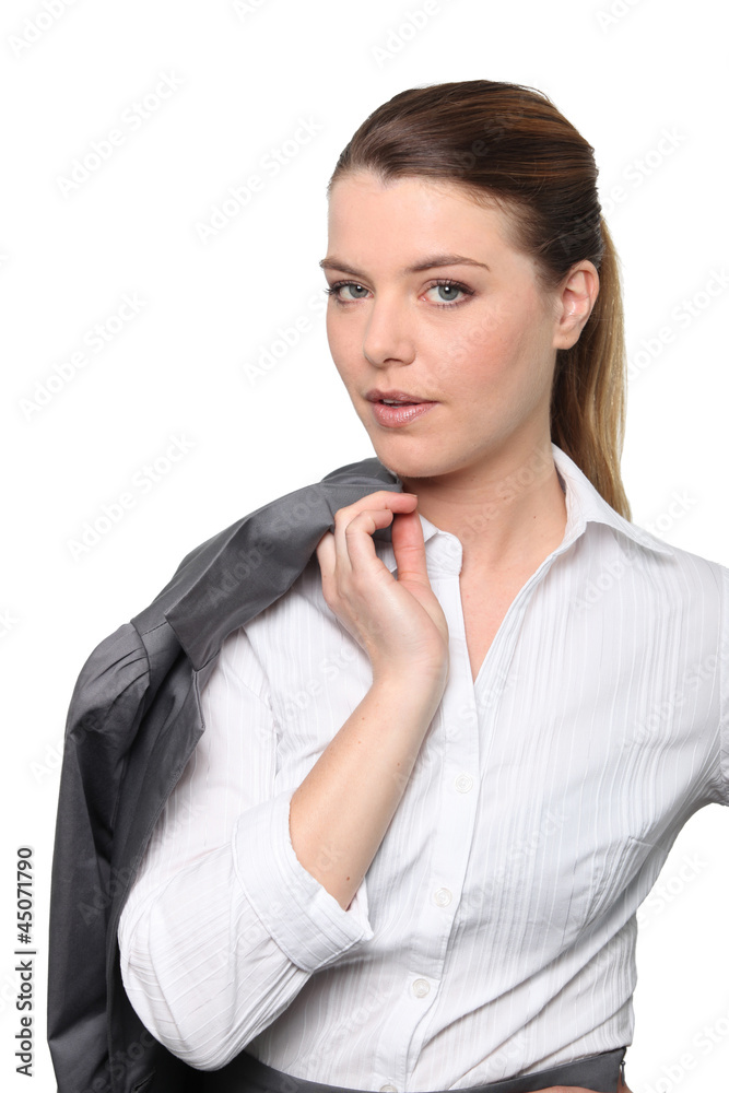 Business woman holding jacket over shoulder Business woman holding jacket over shoulder