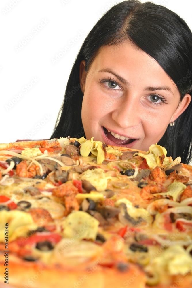 Young happy woman eating pizza, isolated on white Young happy woman eating pizza, isolated on white