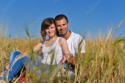 happy couple in wheat field © .shock