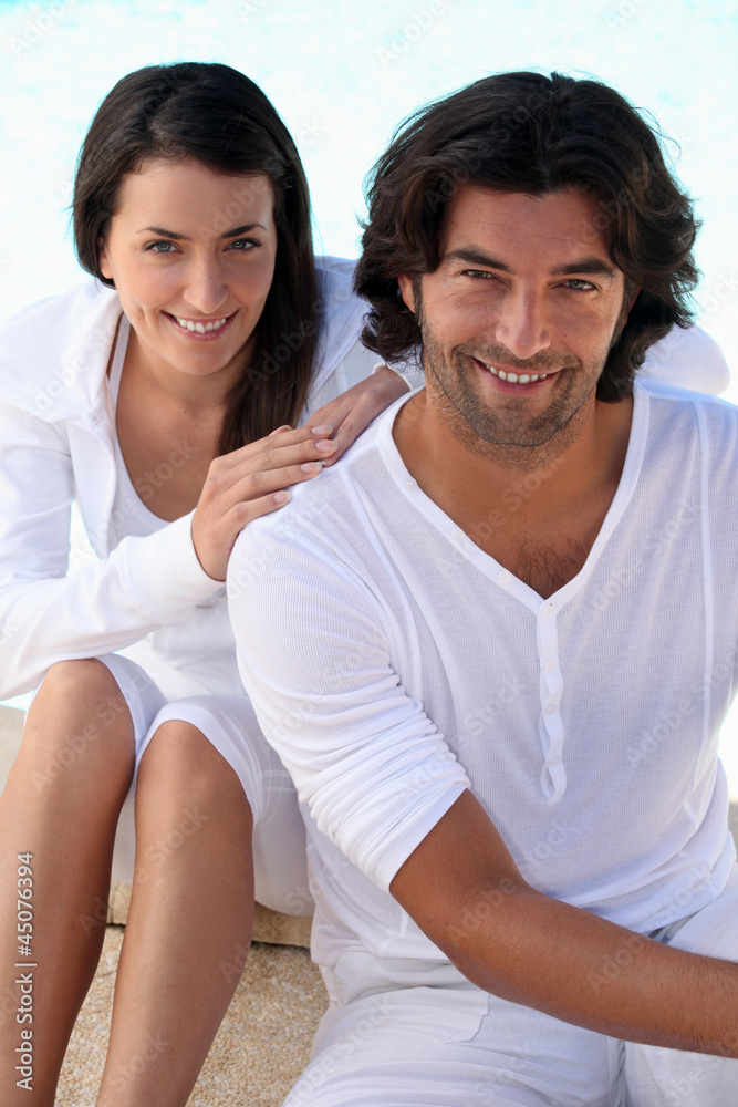 Studio portrait of a relaxed couple on white Studio portrait of a relaxed couple on white