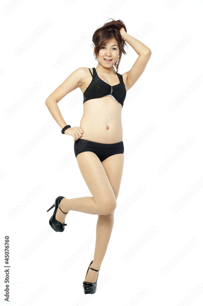 young Asian girl in bikini with a tape around her waistline