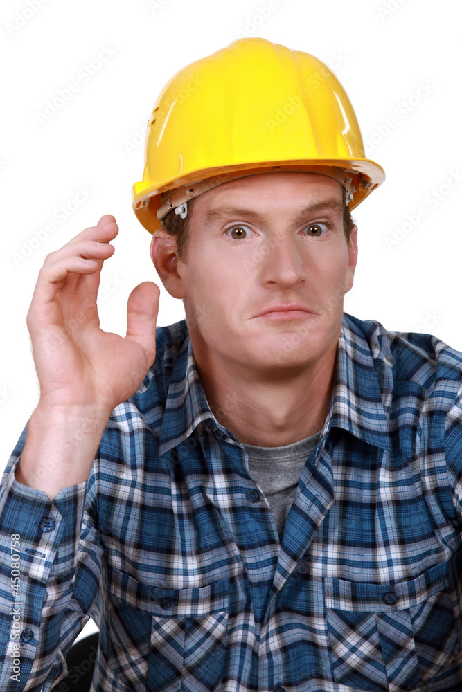 Dumbfounded construction worker Dumbfounded construction worker