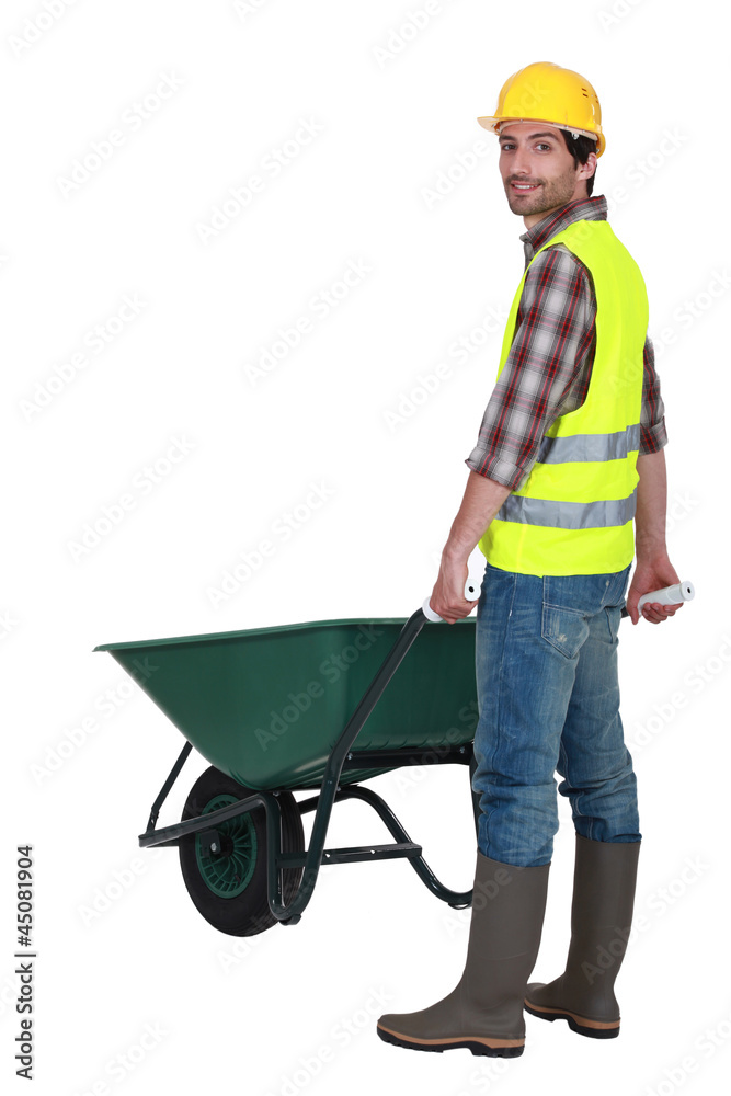 Man pushing wheelbarrow Man pushing wheelbarrow