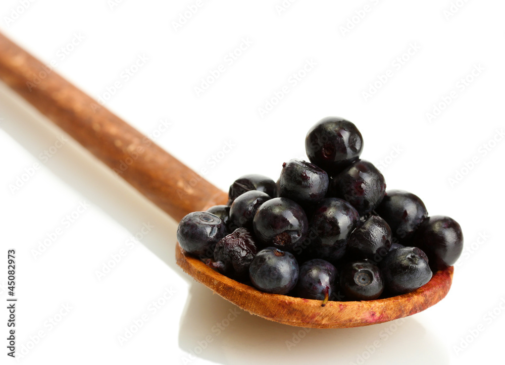 blueberries in wooden spoon isolated on white blueberries in wooden spoon isolated on white