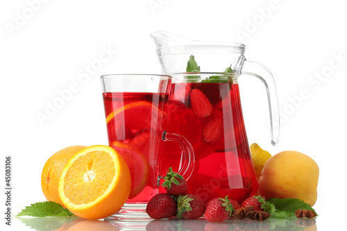 sangria in jar and glass with fruits, isolated on white