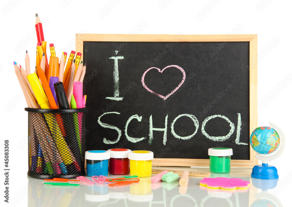 Small school desk with various school supplies close-up Small school desk with various school supplies close-up