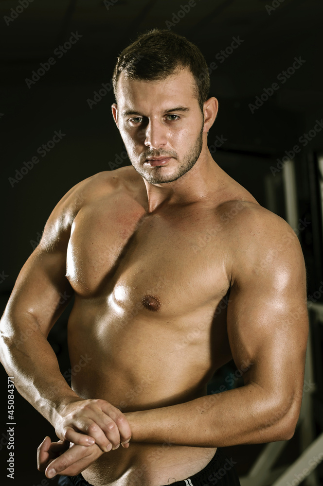 Fototapeta premium Showing muscles in gym