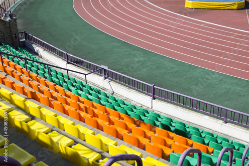 rows of plastic seats at stadium photo