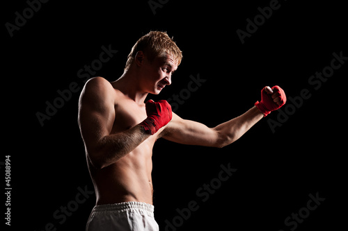 fighter boxing in the dark room © ArtFamily