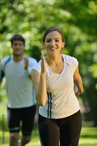 Young couple jogging at morning
