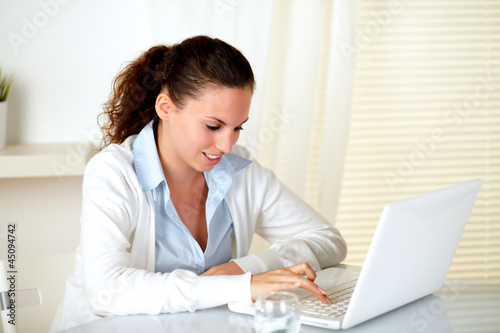 Caucasian young woman browsing the internet