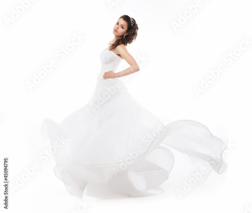 Beauty bride in wedding fashion white dress running